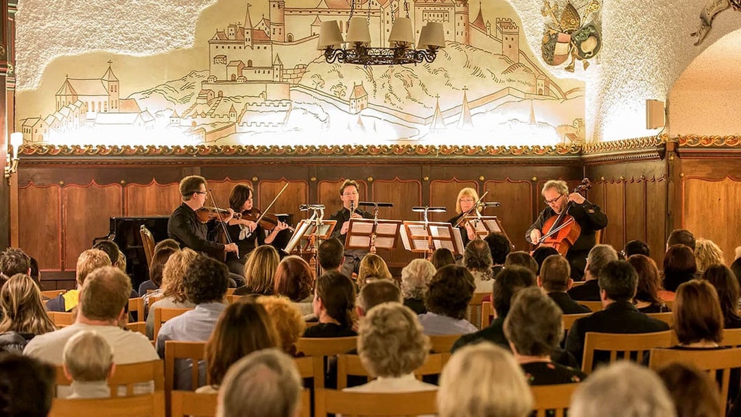 Musicians performing Mozart at Fortress Hohensalzburg concert hall in Salzburg, Austria.