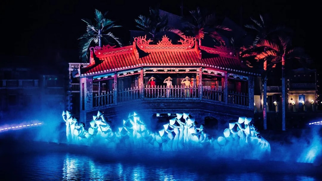 Hoi An Memories Show in Vietnam with performers on a lit stage by the water.