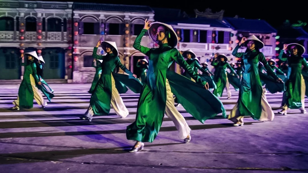 Performers in traditional attire at Hoi An Memories Show, Vietnam.