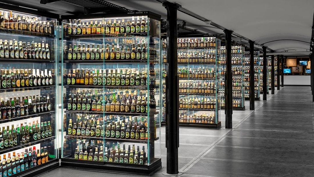 Carlsberg beer bottle collection display inside Home of Carlsberg exhibit.