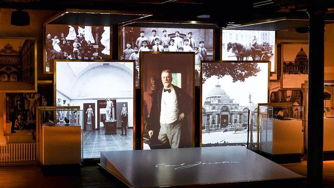 Exhibit of historical photos and artifacts inside the Home of Carlsberg.