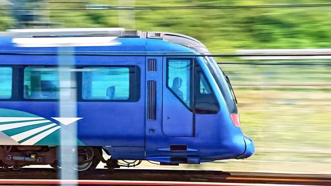 High-speed train traveling between Hong Kong International Airport and city center.