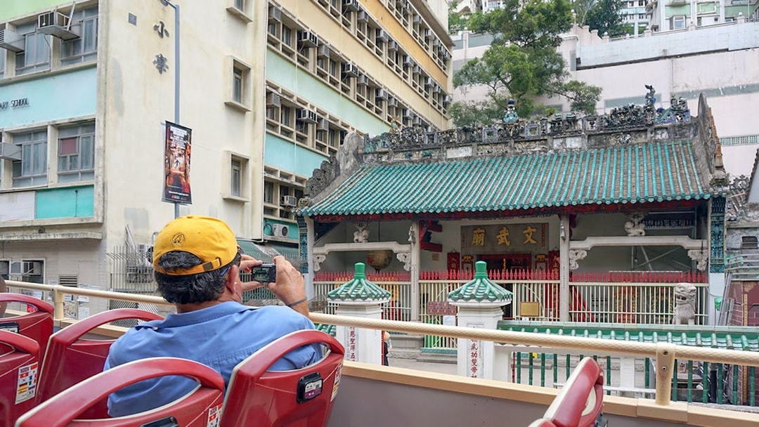 Guest photographing Man Mo Temple from Big Bus tour in Hong Kong.