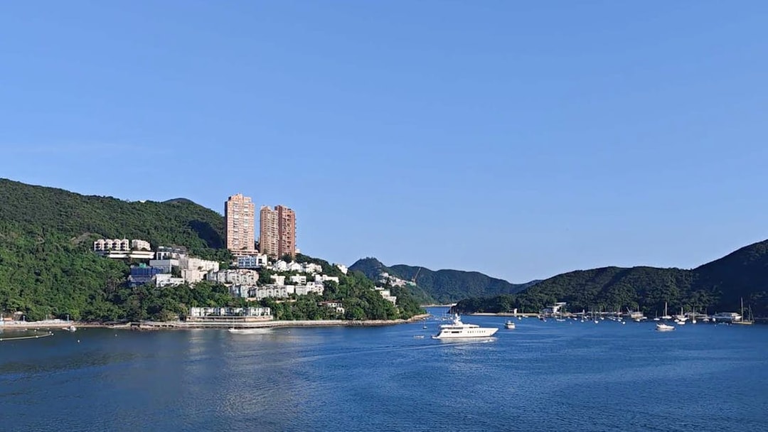 Coastal view with yachts and hillside buildings on Big Bus Hop-On Hop-Off Tour.