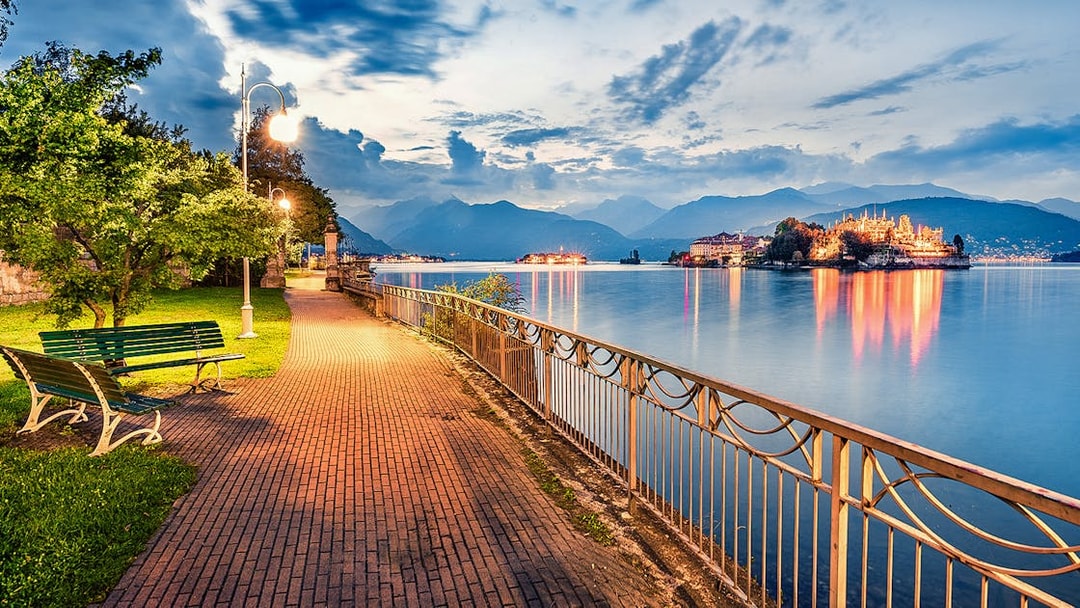 Pathway along Lake Maggiore with view of Isola Bella, Isole Borromee, Italy.