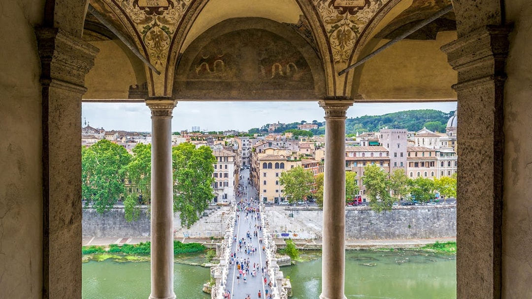 View of Rome from Castel Sant'Angelo, overlooking the Tiber River and cityscape.