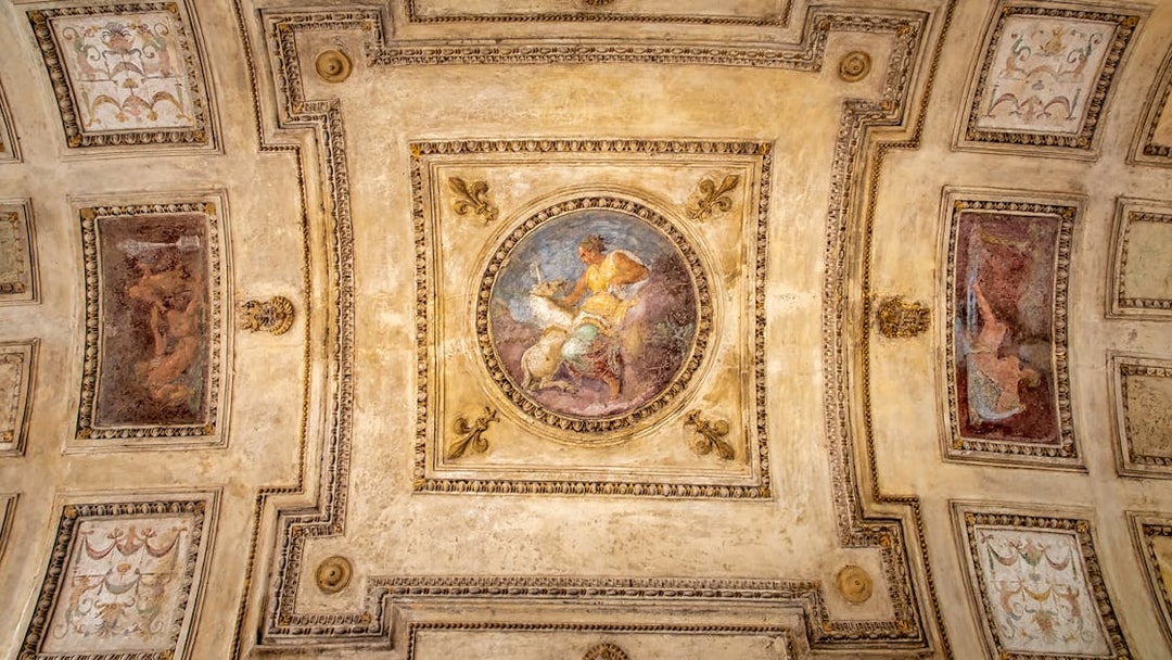Ceiling fresco at Castel Sant'Angelo in Rome, Italy, featuring mythological scene.