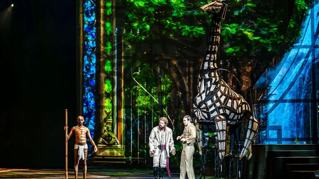 Performers with giraffe puppet during House of Dancing Water show.
