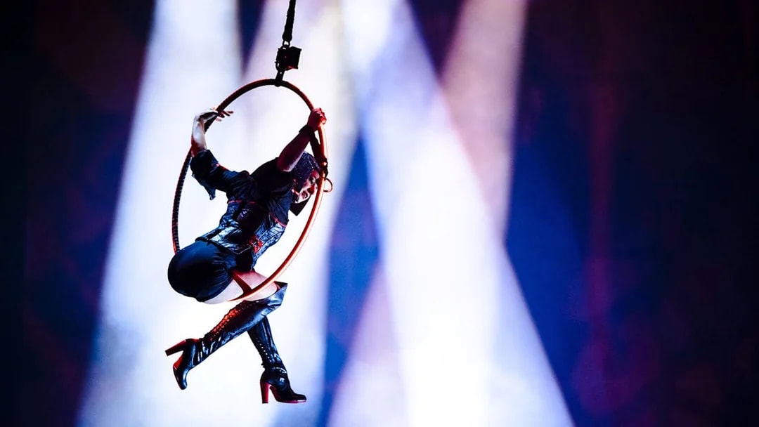 Performer on aerial hoop during House of Dancing Water show.