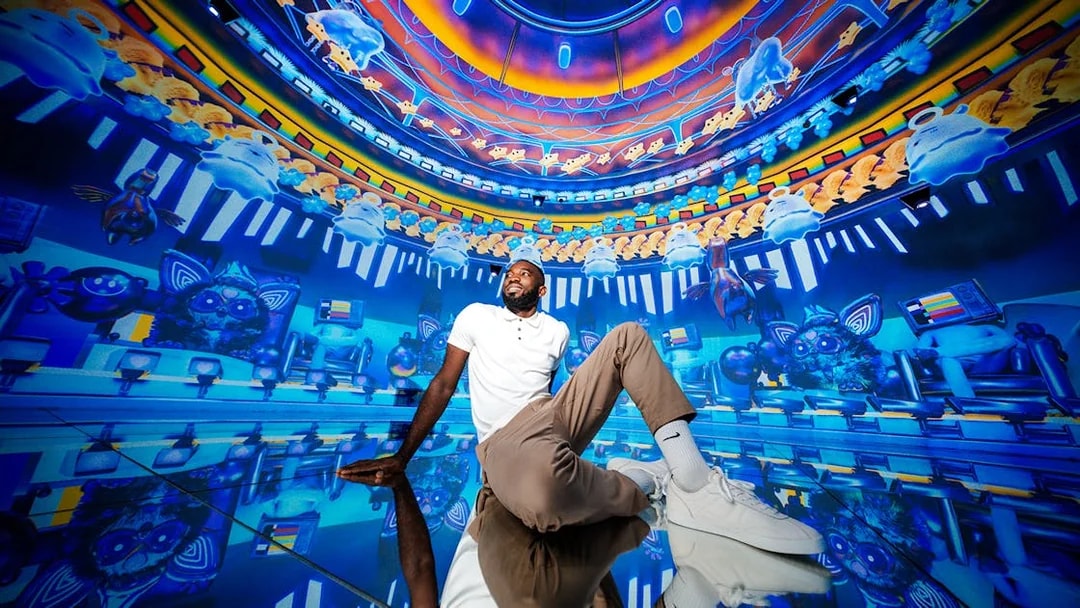 Visitors interacting with vibrant digital displays at House of Hype.