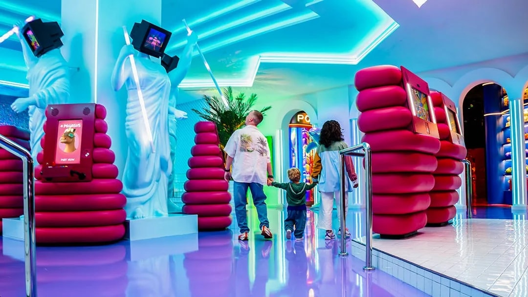 Visitors exploring interactive digital displays at House of Hype.
