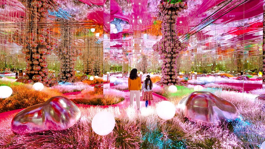 Visitors exploring a vibrant mirrored room at House of Hype, Dubai.