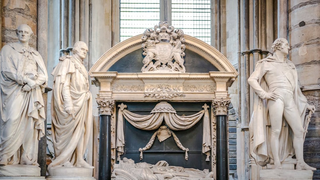 Tomb and statues in Poets' Corner, Westminster Abbey, London.