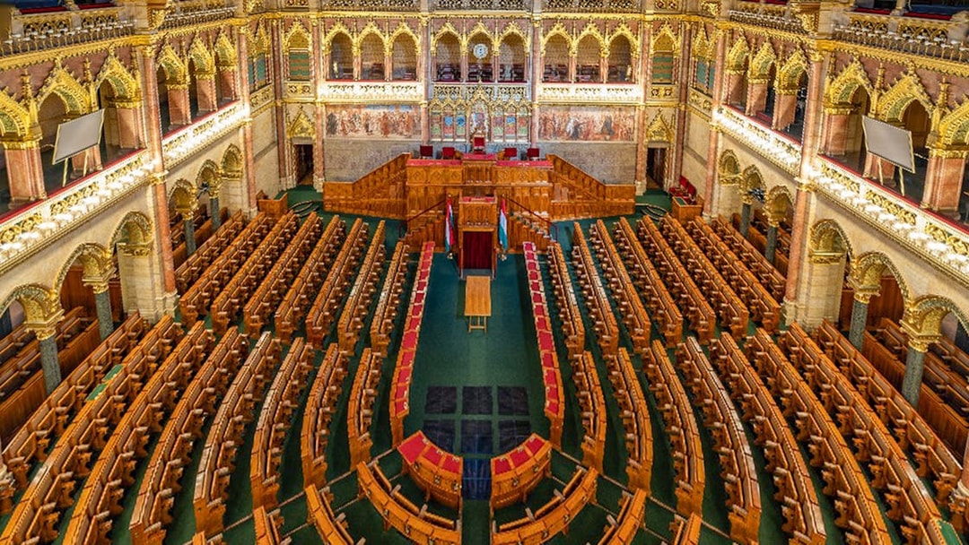 Hungarian Parliament interior with ornate seating in Budapest.