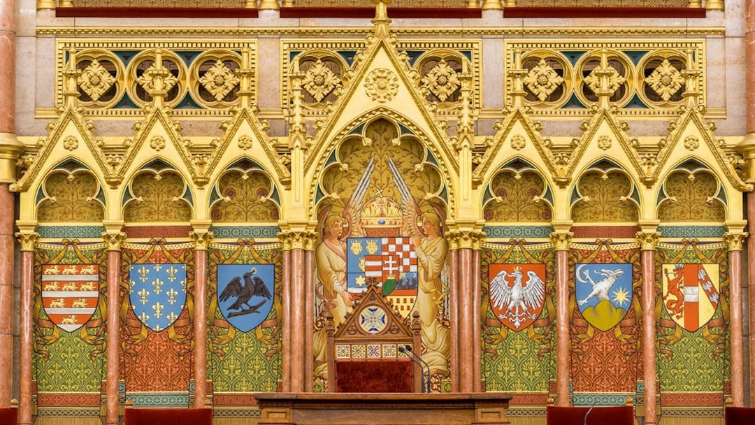 Hungarian Parliament interior with ornate coats of arms, Budapest audio tour.