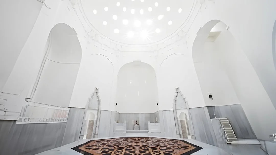 Hurrem Sultan Hamam interior with ornate marble basin in Istanbul.