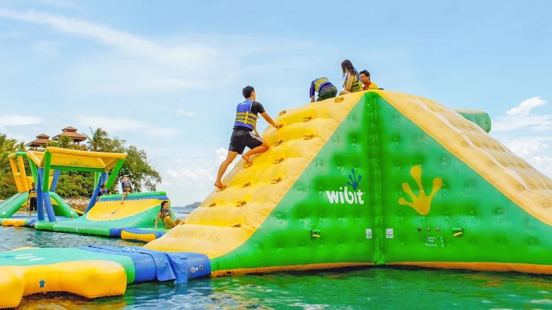 People climbing inflatable obstacle at HydroDash, Singapore.