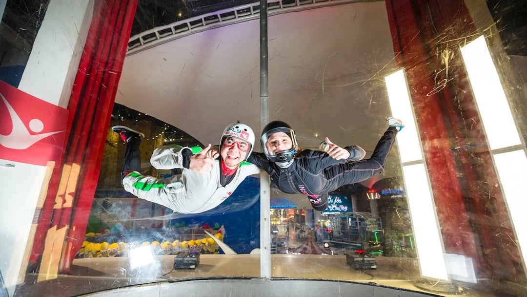 Person and instructor in iFly Dubai indoor skydive experience.