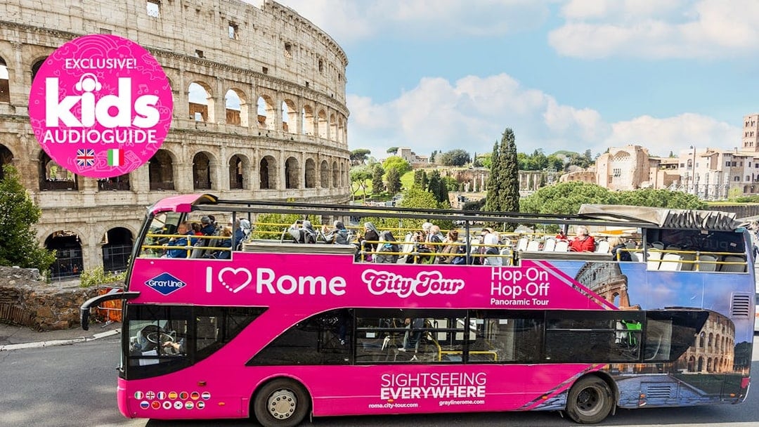 Open-top tour bus in front of the Colosseum, part of the I Love Rome Hop-On Hop-Off Tour.