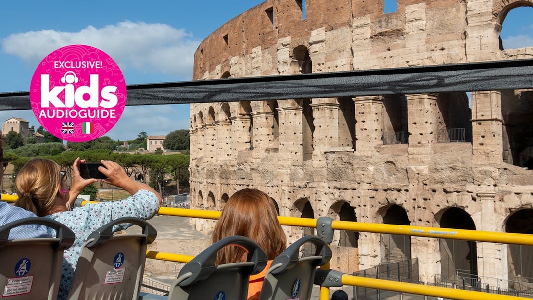 Hop-on hop-off bus near Colosseum in Rome with kids' audio guide.
