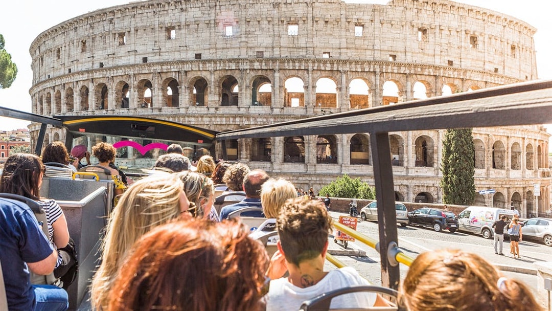 Tourists on a bus near the Colosseum in Rome.