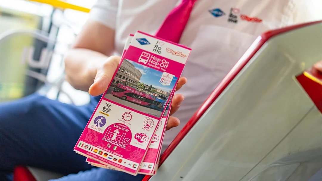 Brochure for I Love Rome Hop-On Hop-Off Tour featuring Colosseum and bus image.