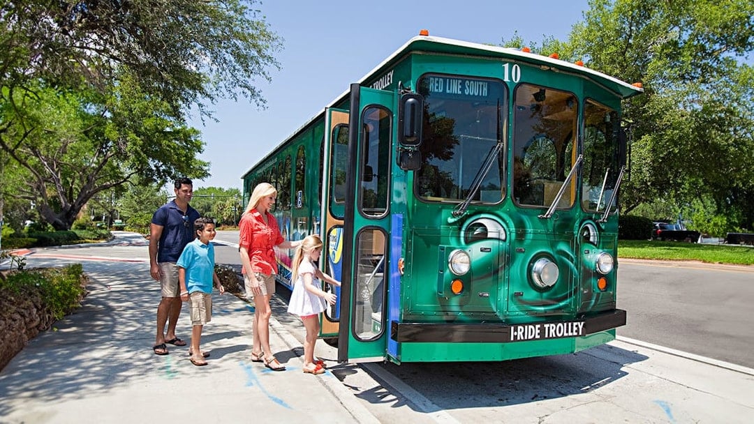 Family boarding I-Ride Trolley on Orlando Hop-On Hop-Off tour.