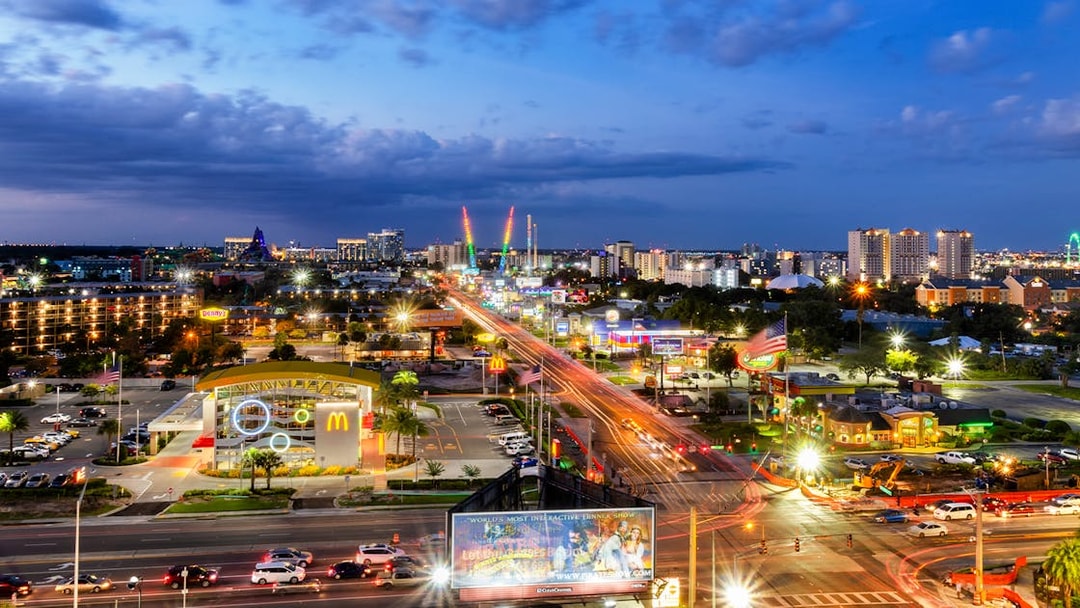 Orlando cityscape at night with illuminated streets and skyline.