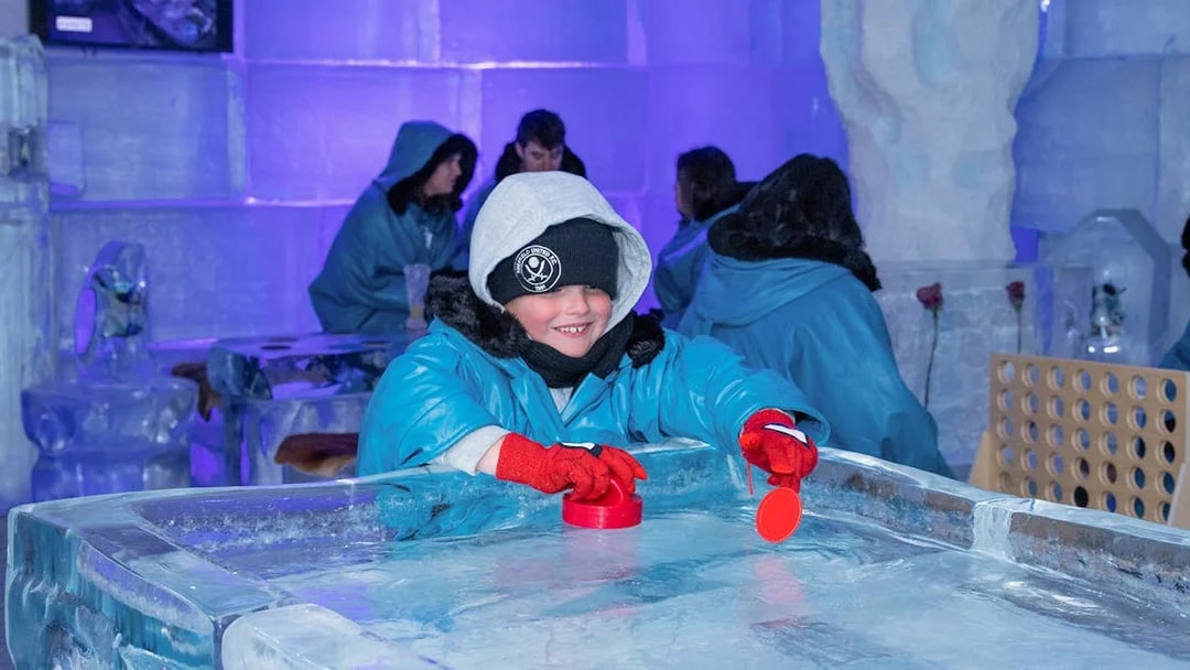 Child playing at ice table in IceBar Surfers Paradise.