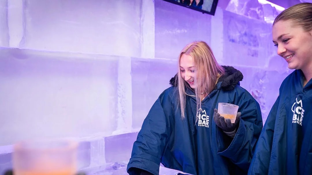 Guests enjoying drinks at IceBar Surfers Paradise, surrounded by ice walls.