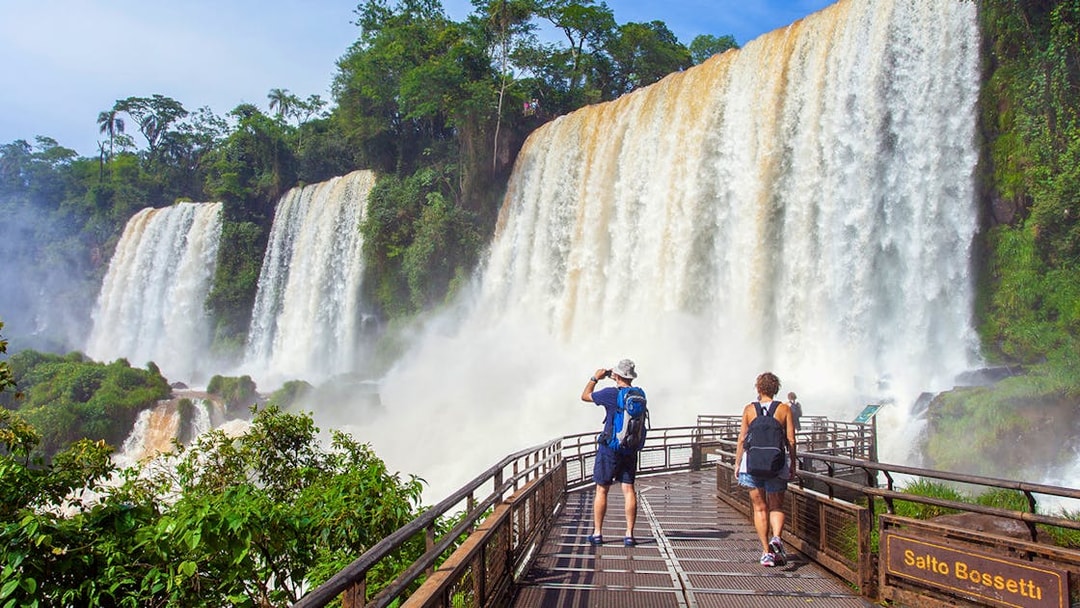 Tourists walking on a platform near Salto Bossetti at Iguazu Falls.