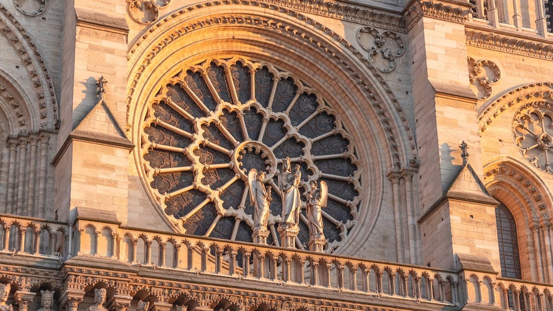 Notre Dame Cathedral facade with detailed rose window, Paris.