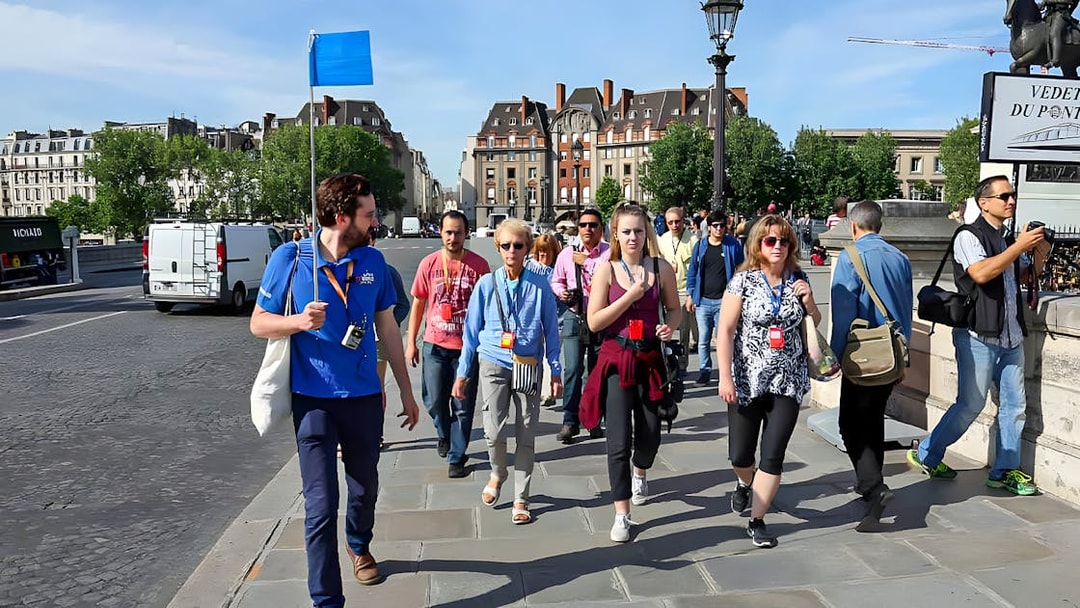 Guide leading a small group near Notre Dame, Paris.