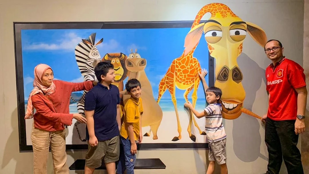 Visitors interacting with 3D animal art at Illusion 3D Art Museum Kuala Lumpur.