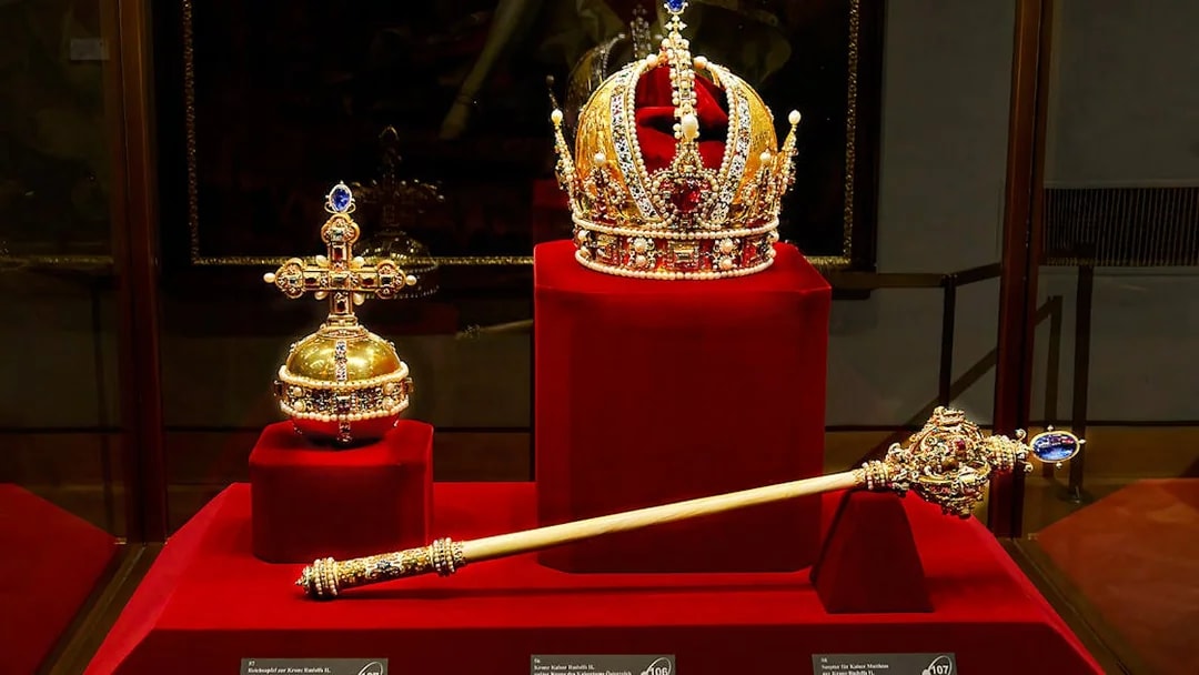 Imperial crown, orb, and scepter displayed at the Imperial Treasury in Vienna.