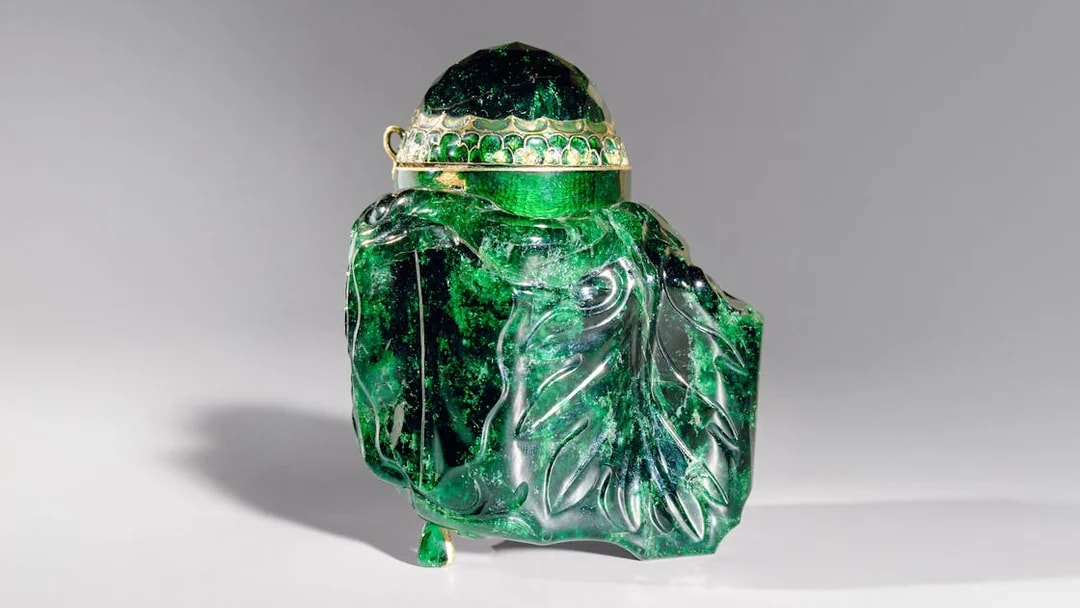 Emerald vessel with intricate carvings at Imperial Treasury Vienna.