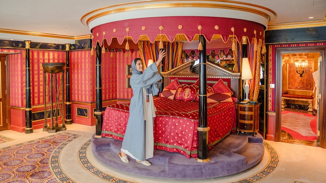 Royal Suite bedroom with ornate canopy bed inside Burj Al Arab, Dubai.