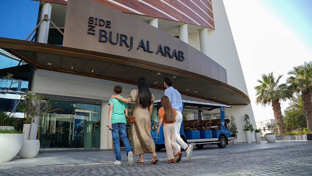 Tourists entering Burj Al Arab for a luxury tour in Dubai.