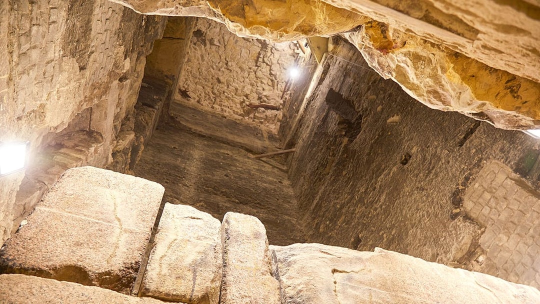 Inside view of the Step Pyramid of Djoser, showcasing ancient stone walls, Saqqara, Egypt.