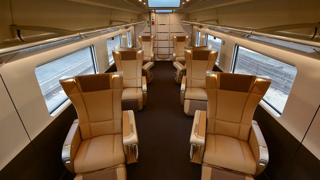 Luxurious train interior with spacious seating, part of the Interrail Global Mobile Pass experience.