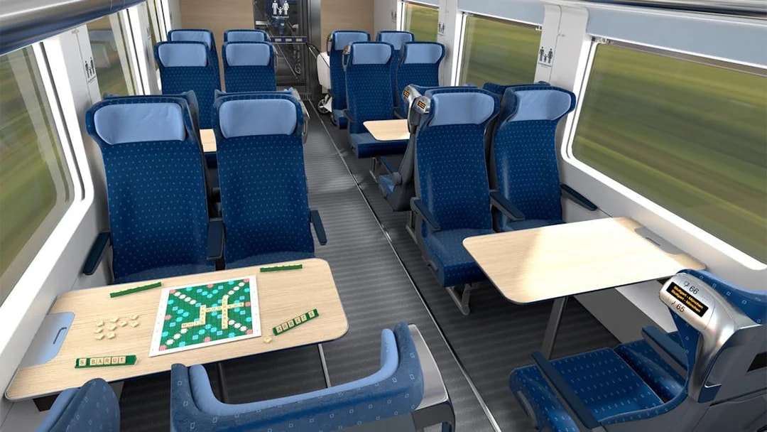 Interrail train seats with tables and a board game setup.