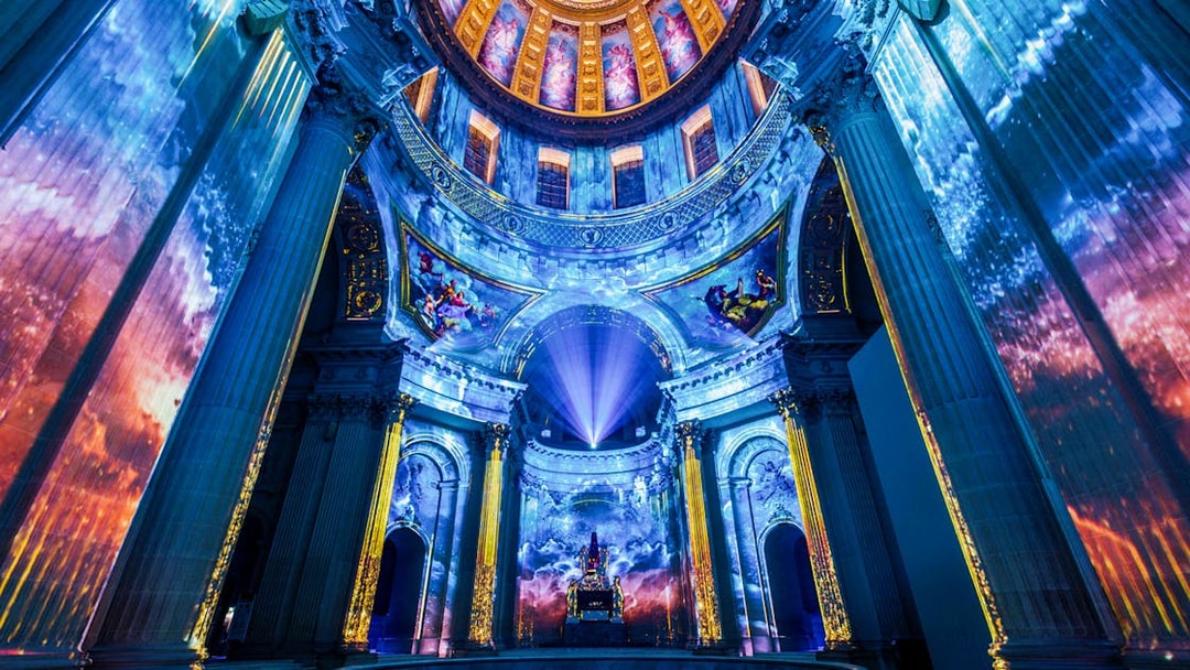 Immersive light projections inside Invalides dome, Paris, for Aura experience.