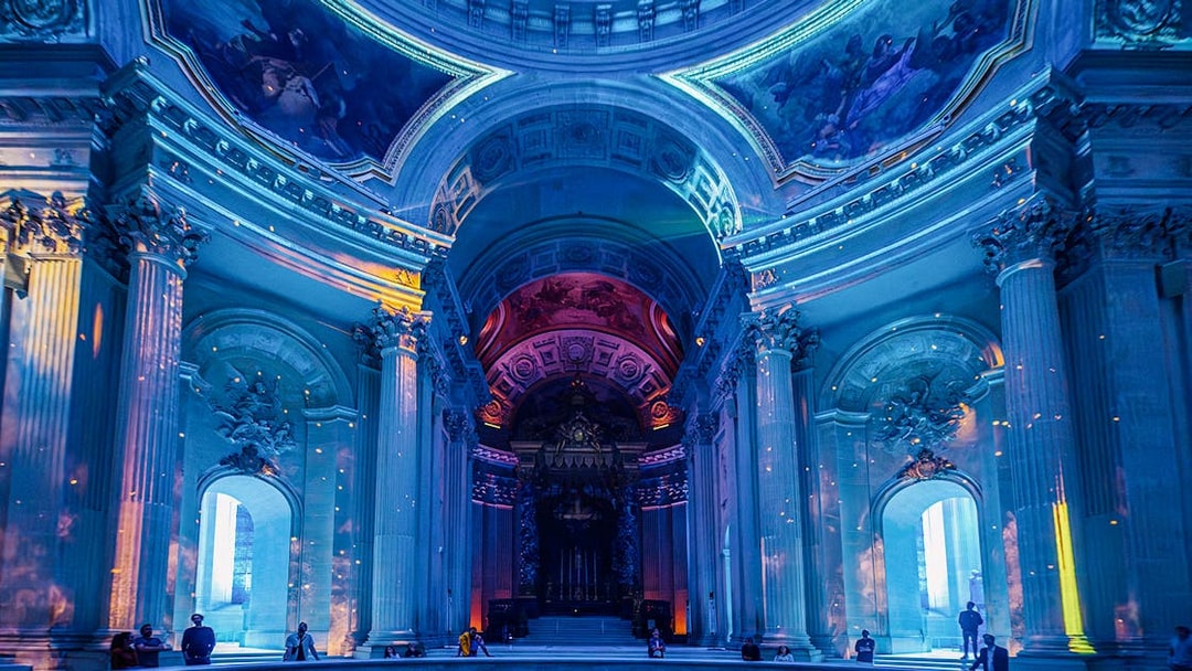 Invalides interior with immersive light display during Aura experience in Paris.