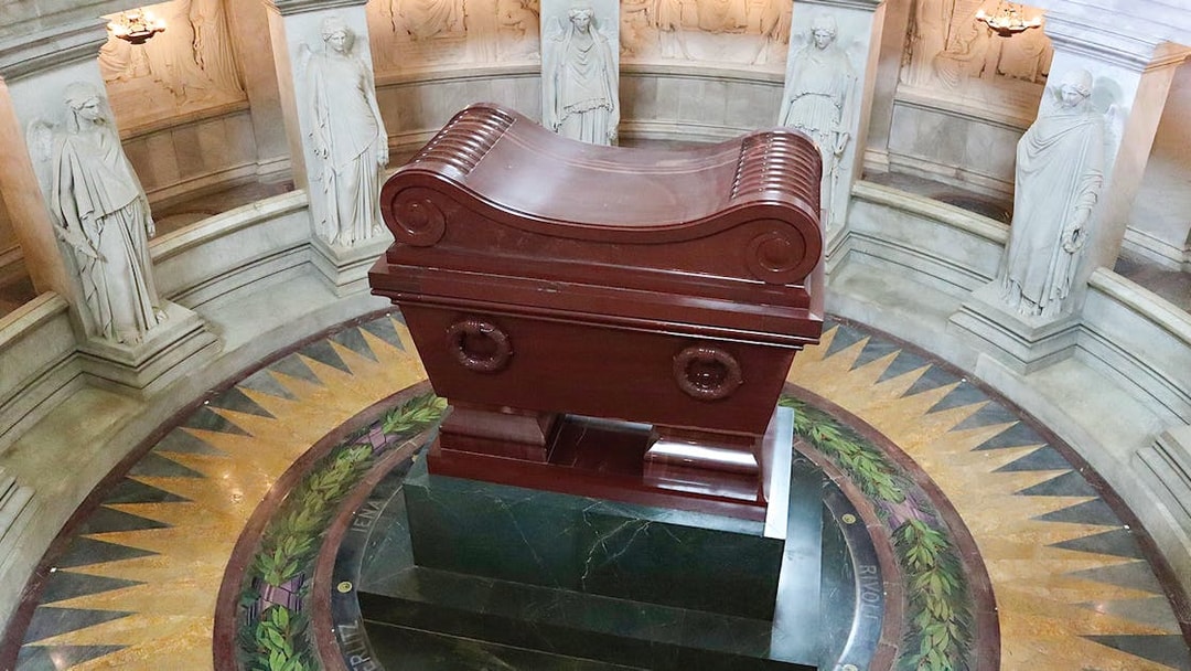 Napoleon's Tomb at Les Invalides, Paris, with ornate sarcophagus and surrounding statues.