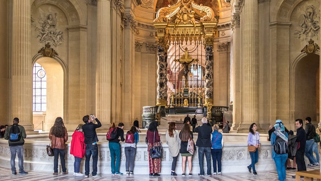 Visitors viewing Napoleon's Tomb at the Invalides, Paris Army Museum.
