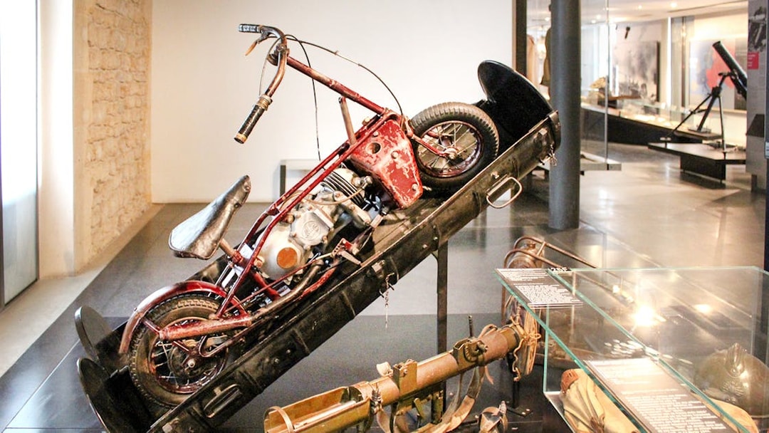 Motorcycle display at Invalides museum, Paris, part of Napoleon's Tomb tour.