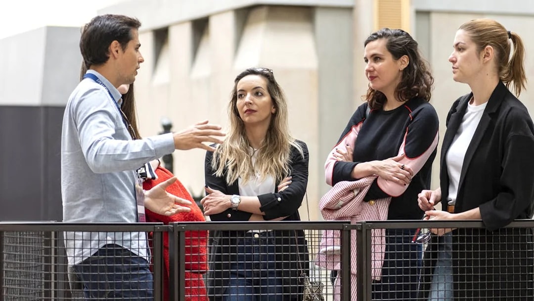 Tour guide explaining to a group during the Invalides & Napoleon's Tomb tour in Paris.