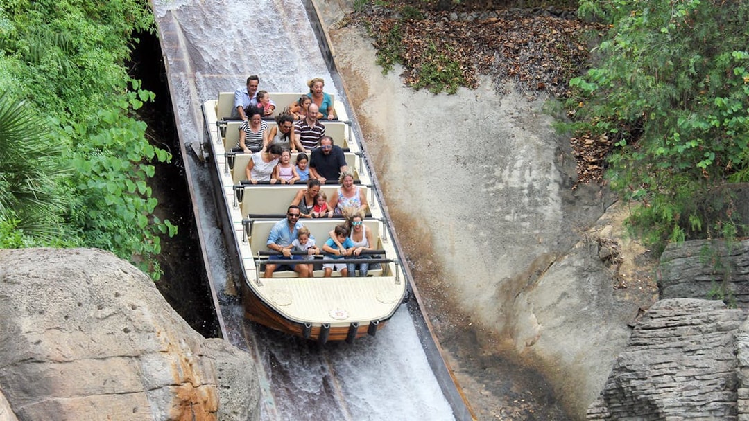Visitors enjoying a log flume ride at Isla Mágica, Seville.