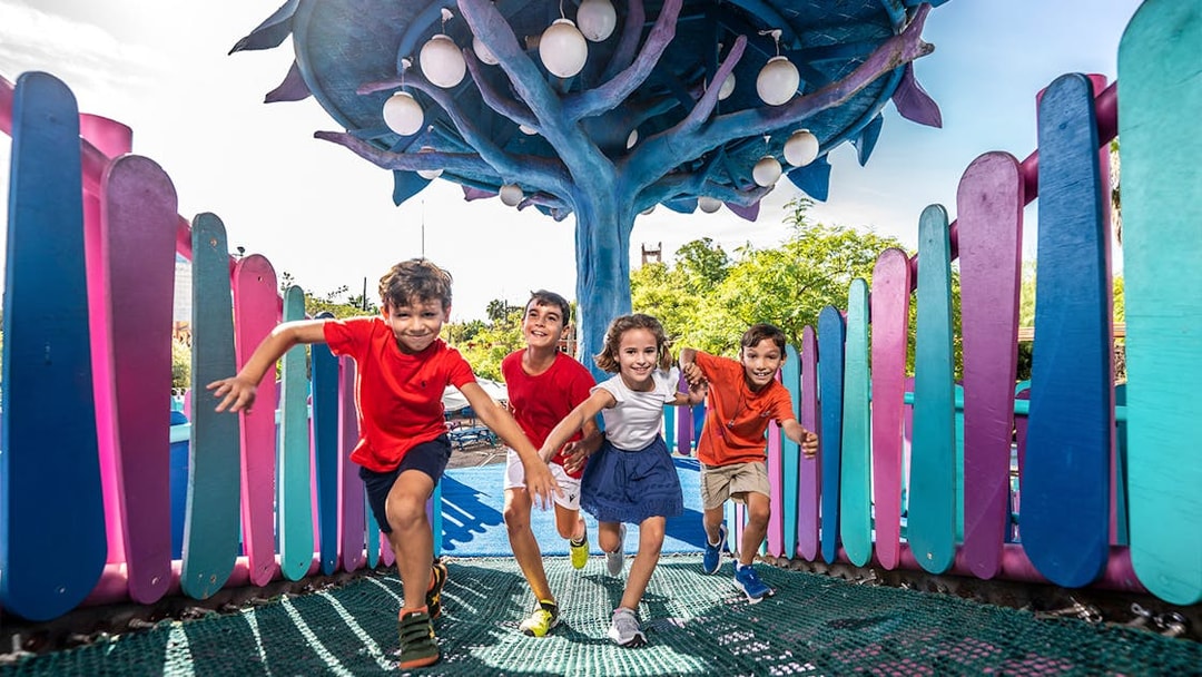 Children playing at Isla Mágica amusement park, Seville, Spain.