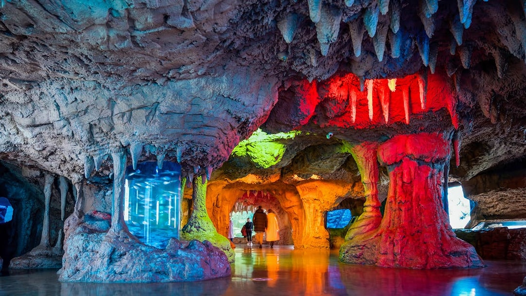 Interior cave-like exhibit with colorful lighting at Istanbul Aquarium, Turkey.